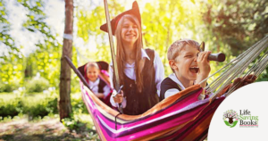 Happy kids playing in the hammock